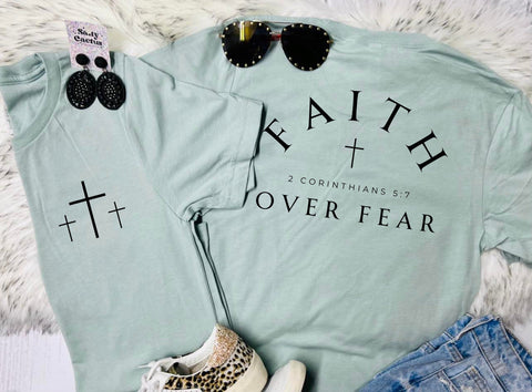 Faith Over Fear Cross Front Pocket & Big on Back Design on Dusty Blue